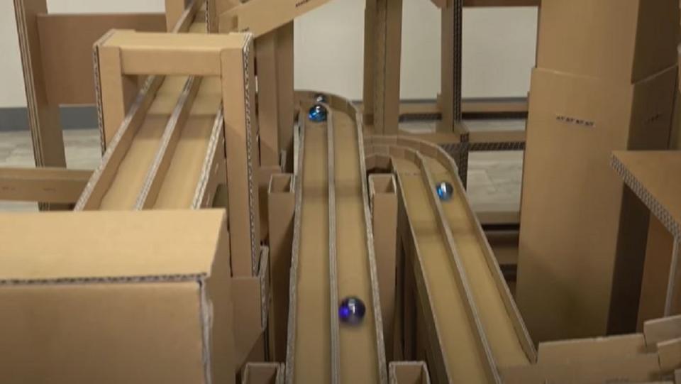 A giant DIY cardboard marble run.