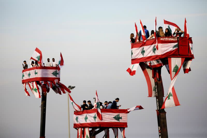 FILE PHOTO: People attend a parade, on the 76th anniversary of Lebanon's independence, from a crane platform at Martyrs' Square in Beirut