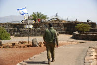 <p>An Israeli soldier walks in an old military outpost, used for visitors to view the Israeli controlled Golan Heights, near the border with Syria, Thursday, May 10, 2018. (Photo: Ariel Schalit/AP) </p>