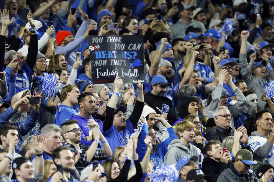 Detroit Lions fans cheer as the team defeats the Los Angeles Ramsduring the second half of an NFL wild-card playoff football game, Sunday, Jan. 14, 2024, in Detroit. (AP Photo/Duane Burleson)