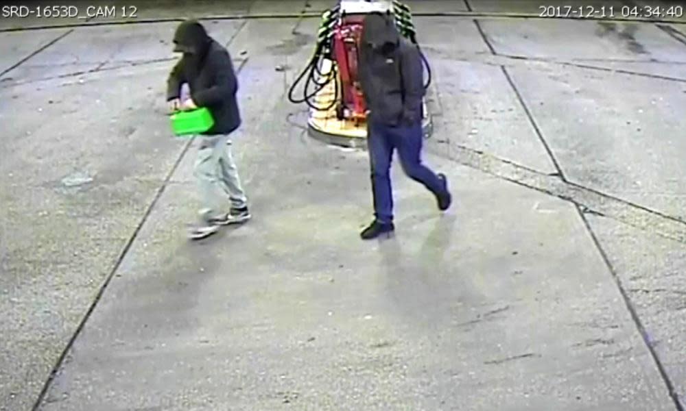 At CCTV still issued by Greater Manchester police shows David Worrall and Zak Bolland buying petrol.