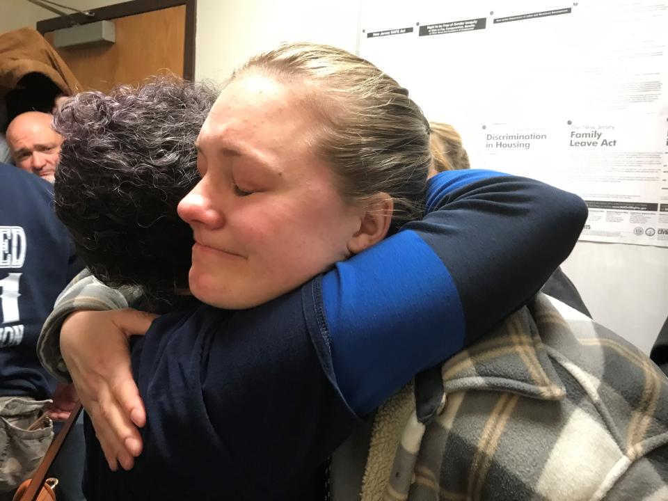 Image: Bordentown Twp EMT Kate Brienza Comforted By City Resident Deirdre Ryan
A sobbing EMT Kate Brienza welcomes a comforting hug from Deirdre Ryan at the prospect of losing her job after Bordentown Township Committee voted March 27 to disband local EMS in favor of privatizing the operation.