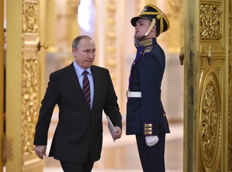 Russia's President Vladimir Putin arrives to chair a meeting of the Pobeda (Victory) Organising Committee, with a focus on developing humanitarian cooperation at the government and public level with other countries, in order to promote objective information on Russia’s history and present, including its role in the victory over Nazism, at the Kremlin in Moscow on April 20, 2017. REUTERS/Alexander Nemenov/Pool