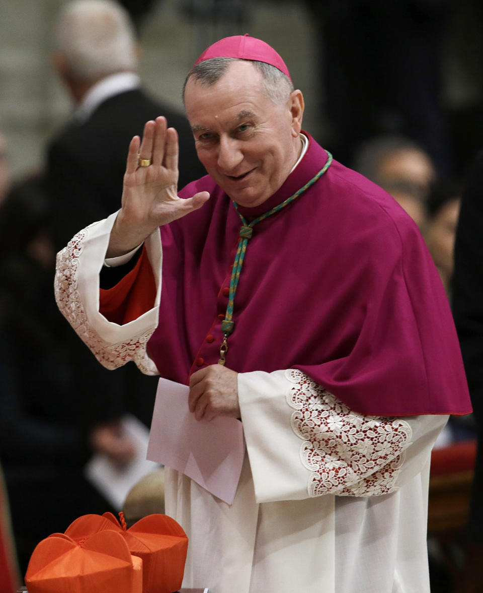 CAPTION CORRECTS YEAR OF ANNOUNCEMENT. FILE - In this Nov. 30, 2013 file photo Vatican Secretary of State Archbishop Pietro Parolin waves to faithful prior to the start of Pope Francis's Vespers prayer in St. Peter's Basilica at the Vatican. Parolin is amongst the 19 new cardinals that Pope Francis announced Sunday, Jan. 12, 2014 during his Angelus prayer from his studio window overlooking St. Peter's Square. The ceremony to formally install them as cardinals will be held Feb. 22 at the Vatican. (AP Photo/Gregorio Borgia, file)