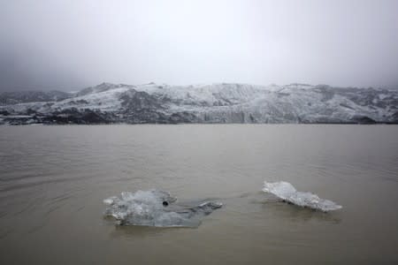 A view shows ice flow floating on a lake in front of the Solheimajokull Glacier, where the ice has receded by more than 1 kilometer since annual measurements began in 1931, Iceland