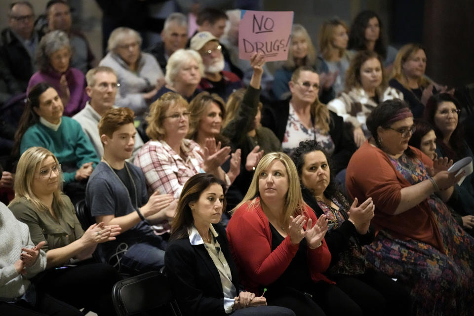 People applaud during a rally in favor of legislation banning gender-affirming healthcare for minors, Monday, March 20, 2023, at the Missouri Statehouse in Jefferson City, Mo. (AP Photo/Charlie Riedel)