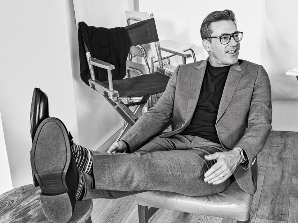 Styled by Taylor Jacobson. Paul Smith suit, sweater, socks and shoes; Hamm’s own watch, jewelry, glasses. Grooming by Kim Verbeck.