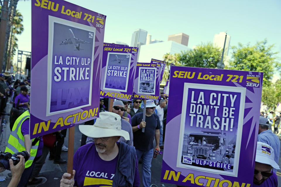 Workers picket outside of City Hall, Tuesday, Aug. 8, 2023, in Los Angeles. Thousands of Los Angeles city employees, including sanitation workers, engineers and traffic officers, walked off the job for a 24-hour strike alleging unfair labor practices. The union said its members voted to authorize the walkout because the city has failed to bargain in good faith and also engaged in labor practices that restricted employee and union rights. (AP Photo/Ryan Sun)