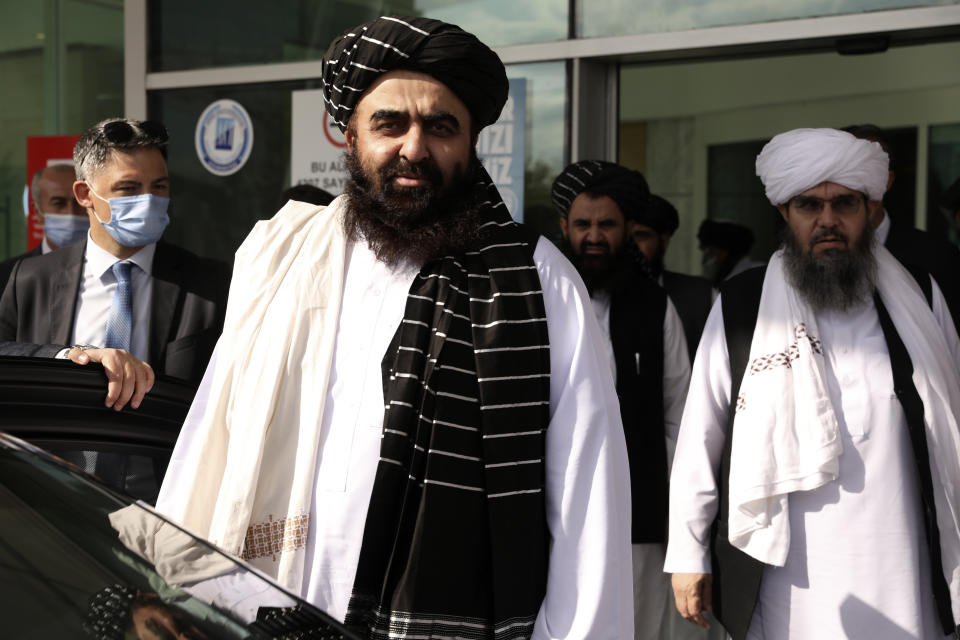 The Taliban delegation led by Amir Khan Muttaqi, the acting foreign minister, front, at Esenboga Airport, arrive in Ankara, Turkey, Thursday, Oct. 14, 2021. A high-level delegation of Afghanistan's new Taliban rulers has arrived in Turkey for talks with Turkish officials, the Foreign Ministry announced Thursday. The meetings in the capital of Ankara would be first between the Taliban and senior Turkish government officials after the group seized control of Afghanistan. (AP Photo/Burhan Ozbilici)