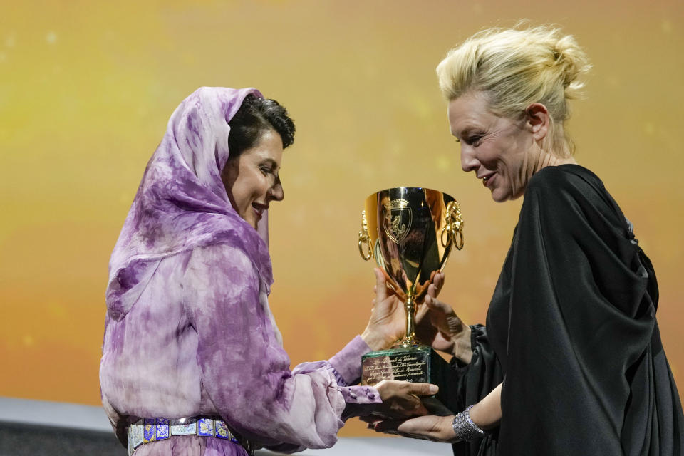 Jury member Leila Hatami, left, presents Cate Blanchett the Coppa Volpi award for best actress for the film 'Tar' at the closing ceremony of the 79th edition of the Venice Film Festival in Venice, Italy, Saturday, Sept. 10, 2022. (AP Photo/Domenico Stinellis)