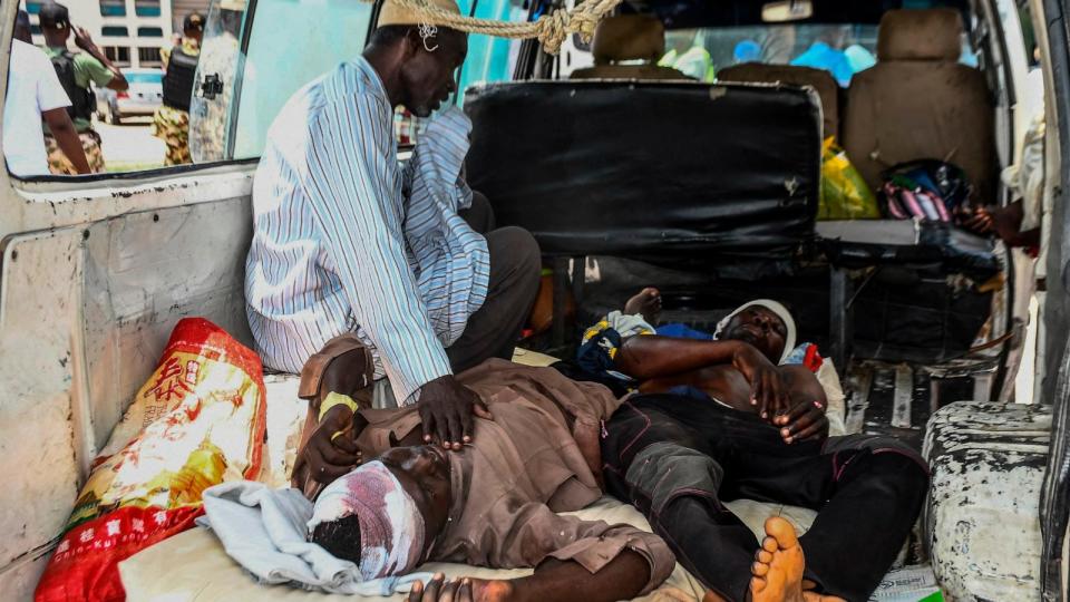 Injured men lay in a van as they arrive for treatment after a wave of suicide attacks in the northeast of Nigeria, in Maiduguri on June 29, 2024. (Photo by Audu MARTE / AFP)  (Afp Contributor#afp/AFP via Getty Images)