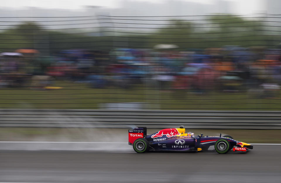 Red Bull Racing driver Sebastian Vettel of Germany drives during the qualifying session of the Chinese Formula One Grand Prix at Shanghai International Circuit in Shanghai, China Saturday, April 19, 2014. (AP Photo/Andy Wong)