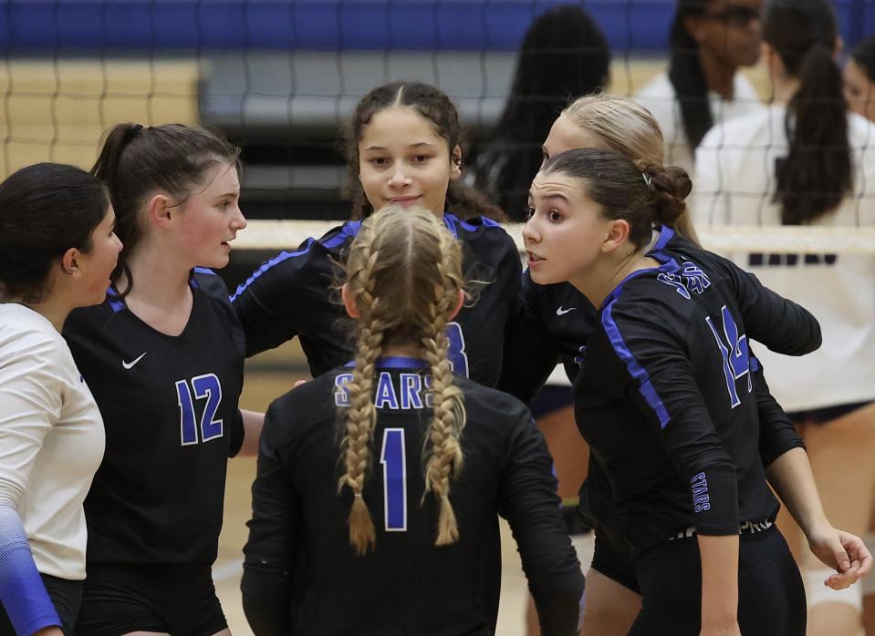 Noah Morris, center, tries to rally her Ann Richards teammates during Monday night's loss to Hendrickson. The core of the Stars' roster is made up of freshmen and sophomores; there are only three seniors on the team.