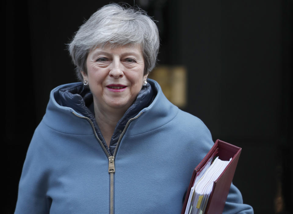 Britain's Prime Minister Theresa May leaves 10 Downing Street for the House of Commons for her weekly Prime Minister's Questions in London, Wednesday, Feb. 20, 2019. May is due to go the Brussels to meet EU leaders for further negotiation on Brexit. (AP Photo/Alastair Grant)