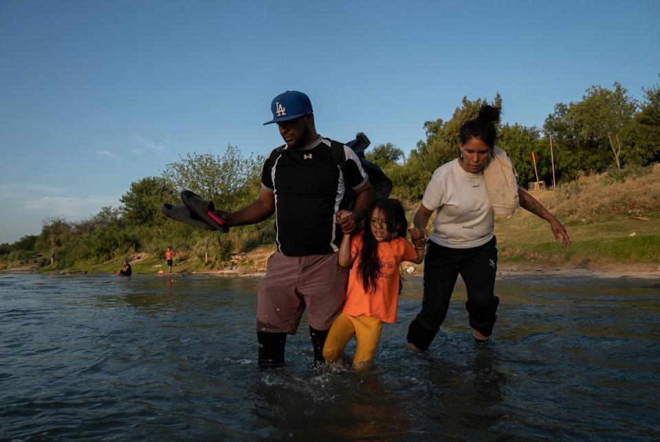 Alexander, 37, his wife Jocelyn, 30, and their six-year old daughter cross the Rio Grande to turn themselves in to U.S. authorities to begin their immigration process in Piedras Negras, Mexico on July 30, 2023. They were both civil engineers in Venezuela and decided to migrate for safety reasons and to give their daughter a better future.
Verónica G. Cárdenas for The Texas Tribune