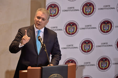 FILE PHOTO - Colombian President Ivan Duque speaks during a hearing at the Constitutional Court in Bogota, Colombia March 7, 2019. Courtesy of Colombian Presidency/Handout via REUTERS