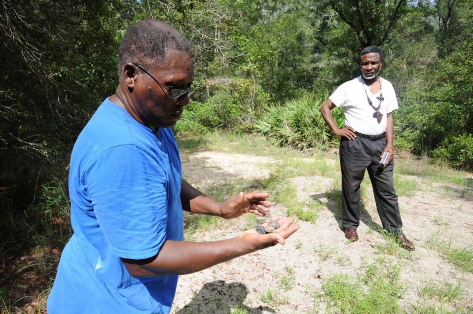 FIU professor Marvin Dunn shows some burned masonry from an old Masonic Lodge that once stood in Rosewood, Florida, on Friday, Aug. 6, 2010.