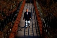 Masanori Numao, whose family runs a ryokan or hot spring inn in Kinugawa Onsen, walks on Takimi bridge in Nikko