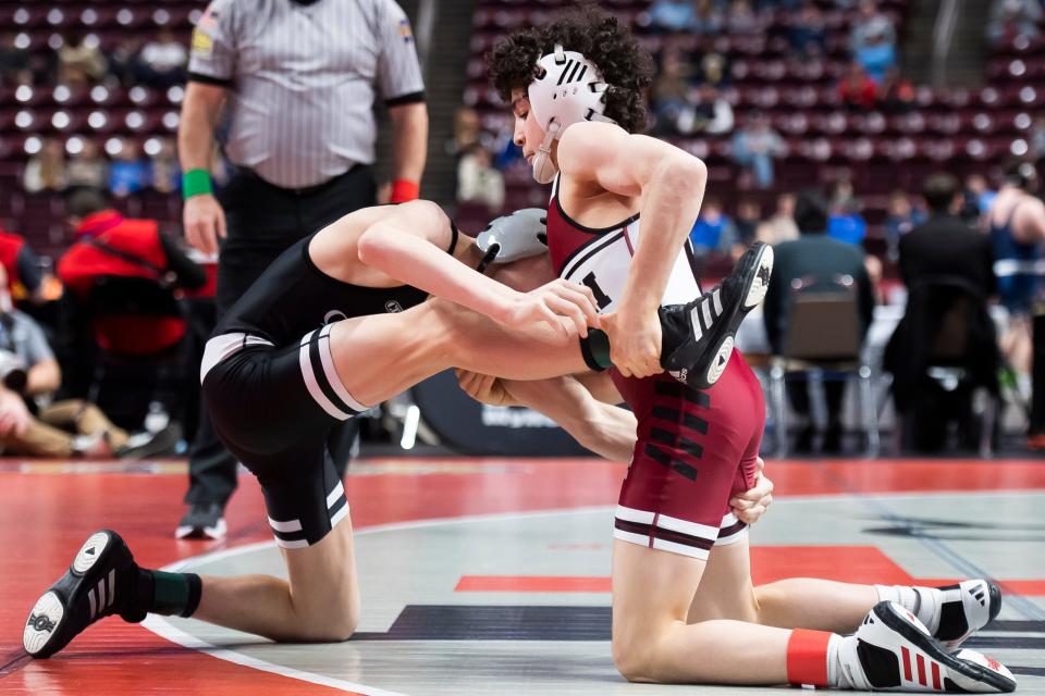 Faith Christian's Joey Bachmann (right) controls Quaker Valley's Bruce Anderchak during a 107-pound first round bout at the PIAA Class 2A Wrestling Championships at the Giant Center on March 7, 2024, in Hershey. Bachmann won by tech fall, 22-7, at 3:16.