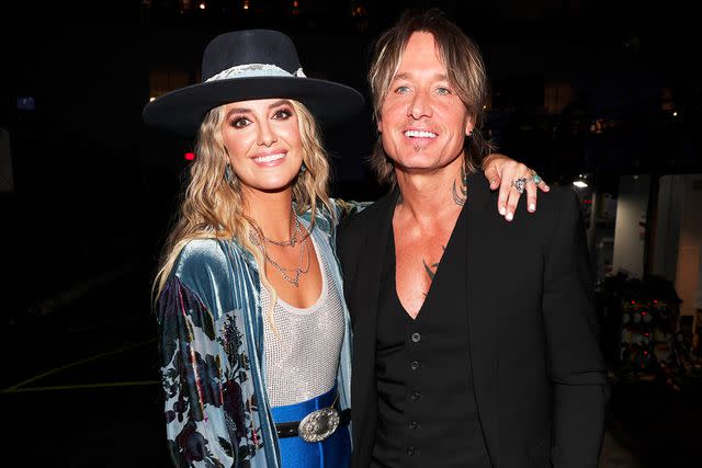 <p>Christopher Polk/Penske Media via Getty</p> Lainey Wilson and Keith Urban in Frisco, Texas in May 2023