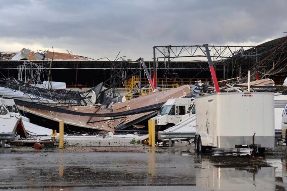 Debris is seen from a damaged FedEx facility after a tornado in Portage, Michigan, on Tuesday (AP)