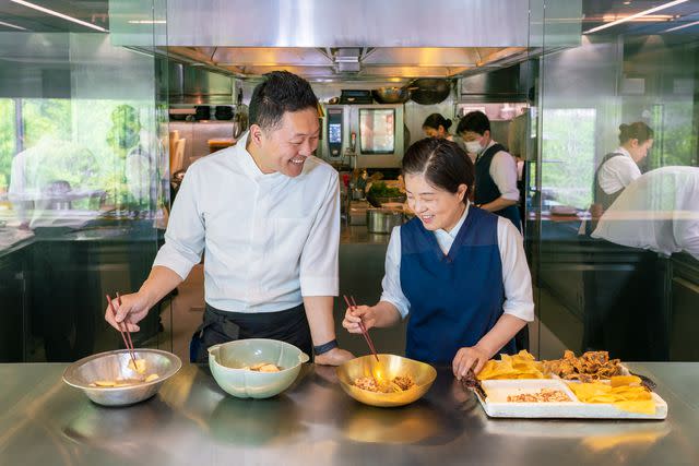 <p>Youngkyu Park</p> Chefs Sung-bae Park (left) and Eun-hee Cho prepare bujak, or deep-fried vegetables, at their restaurant, Onjium.