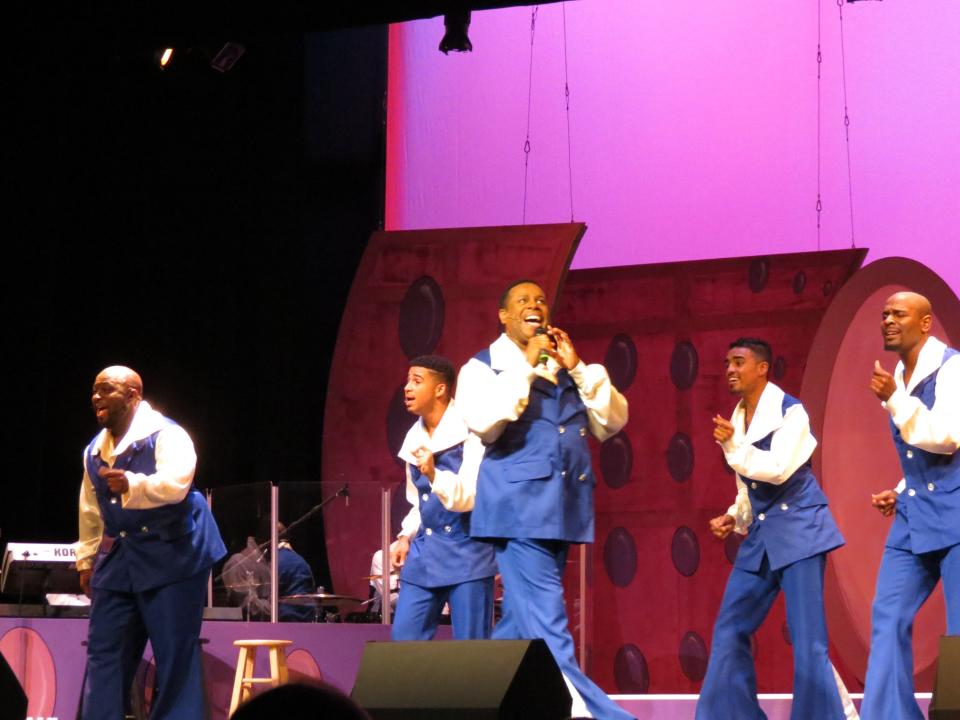 Nate Jacobs, center, founder and artistic director, leads the cast of his show “Soul Crooners 2” at the National Black Theatre Festival in 2015.