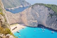 <p>Huge limestone cliffs skyrocket above gorgeous turquoise waters. Whether you come for a day trip or for a few nights while Greek island hopping, make sure you squeeze in an excursion to the notorious shipwreck beach at Smuggler's Cove. </p>