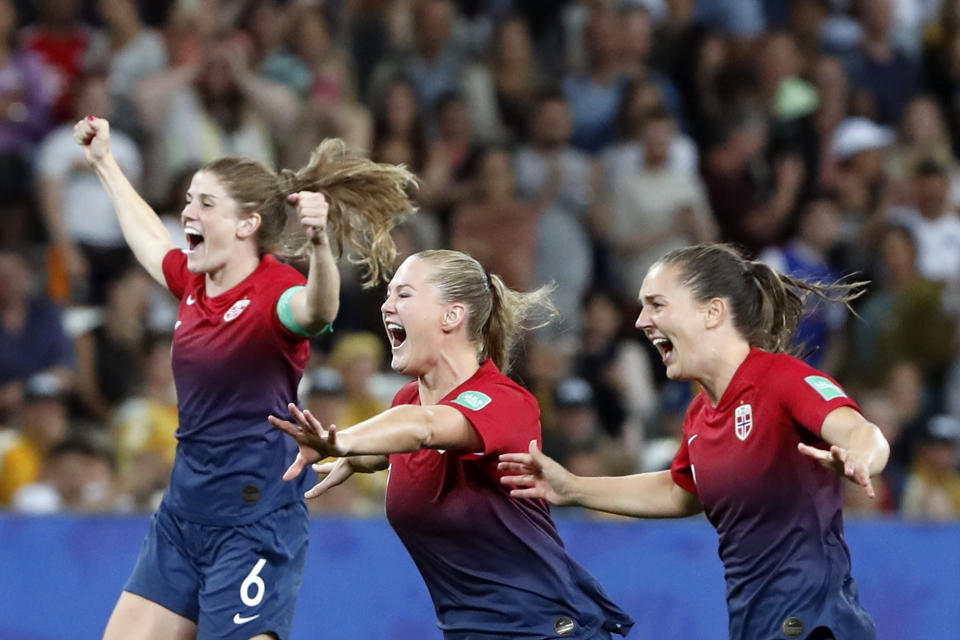 Norway's Maren Mjelde, left, Lisa-Marie Utland, center, and Vilde Boe Risa celebrate after winning the penalty shoot-out of the Women's World Cup round of 16 soccer match between Norway and Australia at the Stade de Nice in Nice, France, Saturday, June 22, 2019. (AP Photo/Thibault Camus)