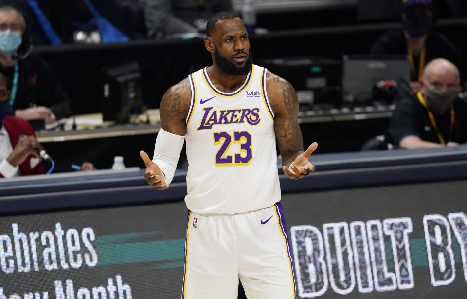 Los Angeles Lakers forward LeBron James questions a call during the first half of the team's NBA basketball game against the Denver Nuggets on Sunday, Feb. 14, 2021, in Denver. (AP Photo/David Zalubowski)
