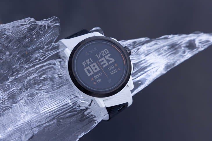 A white watch is wrapped on a piece of ice.