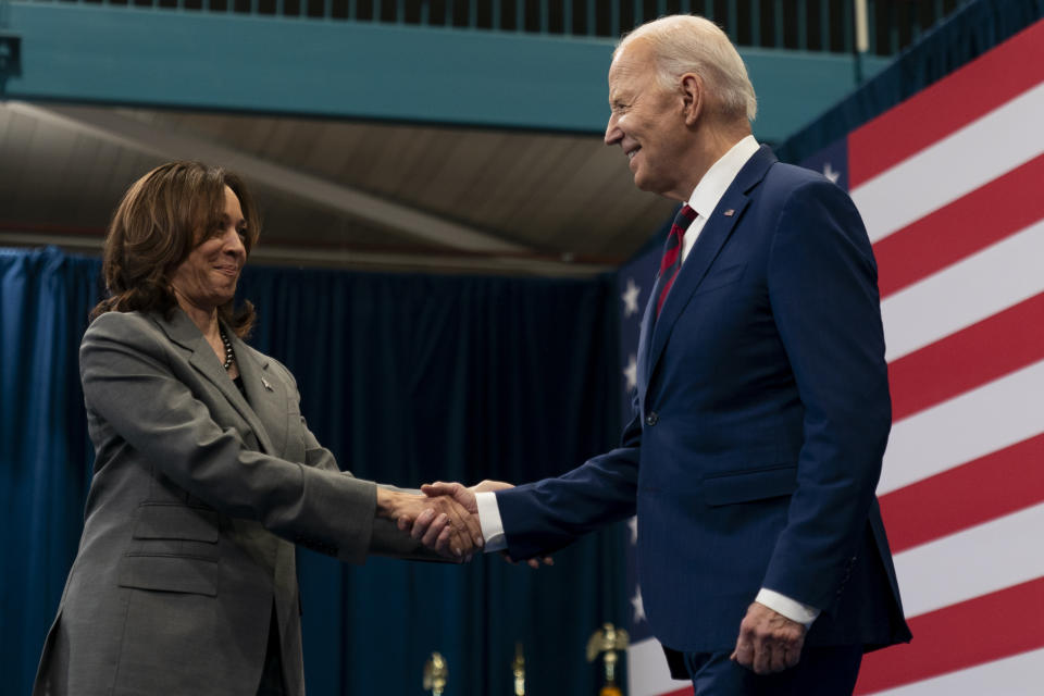 Vice President Kamala Harris, left, shakes hands with President Joe Biden, right, after introducing him at a campaign event in Raleigh, N.C., Tuesday, March 26, 2024. (AP Photo/Stephanie Scarbrough)