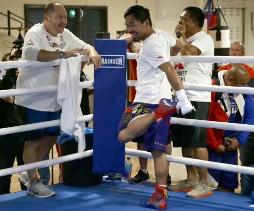 Manny Pacquiao's conditioning coach, Justin Fortune (L) is a former heavyweight who fought off throat cancer