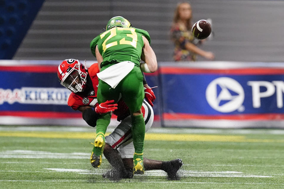 Georgia defensive back Christopher Smith breaks up a pass intended for Oregon wide receiver Chase Cota (23) during the second half of an NCAA college football game Saturday, Sept. 3, 2022, in Atlanta. (AP Photo/John Bazemore)