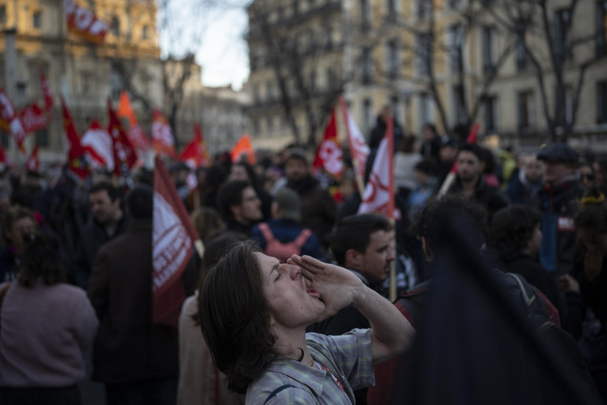 A student shouts during a demonstration in Marseille, southern France, Thursday, March 16, 2023. French President Emmanuel Macron has shunned parliament and imposed a highly unpopular change to the nation's pension system, raising the retirement age from 62 to 64. (AP Photo/Daniel Cole)