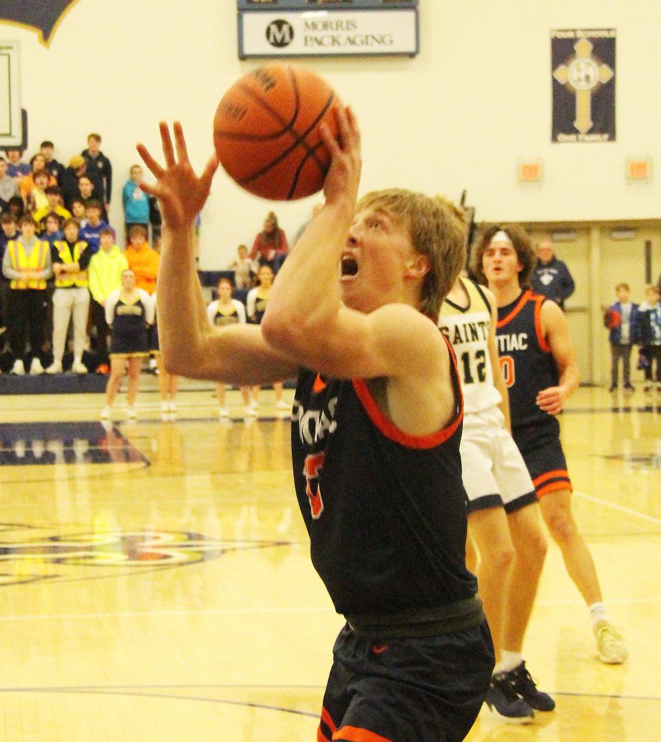 Pontiac's Drew Wayman goes up with a shot attempt Friday at Central Catholic. Wayman scored 6 points in the Tribe's win.