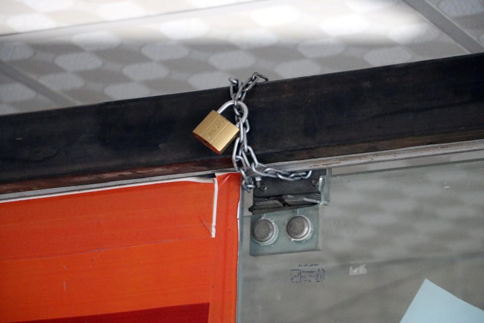 A view of a lock attached to a restaurant closed by the Taliban in Herat province, western Afghanistan, Monday, April 10, 2023. The Taliban have banned families and women from restaurants with gardens or green spaces in Afghanistan's northwestern Herat province, an official said Monday. The moves followed complaints from religious scholars and members of the public about mixing of genders in such places, he said. (AP Photo/Omid Haqjoo)