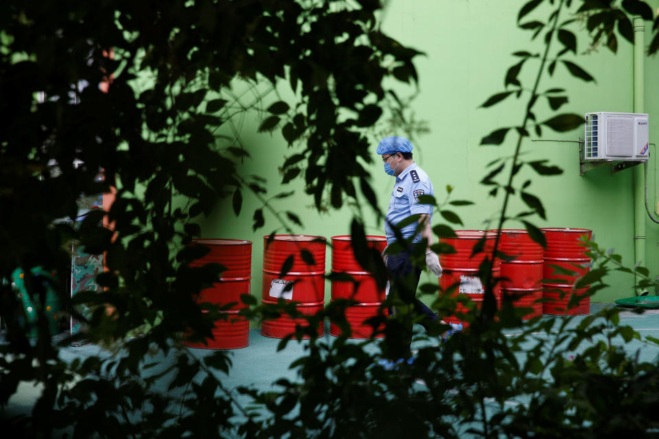 <p>A policeman walks at the scene of an explosion inside a kindergarten in Fengxian County in Jiangsu Province, China, June 16, 2017. (Photo: Aly Song/Reuters) </p>