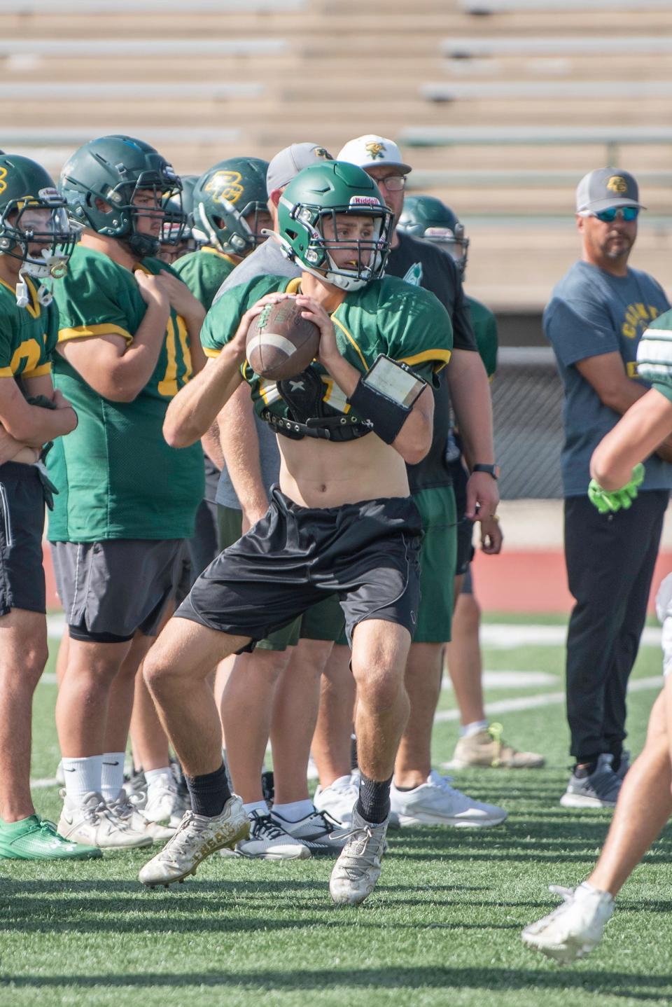 Pueblo County's Cohen Glenn looks for an open receiver during football practice on Friday, August 11, 2023.