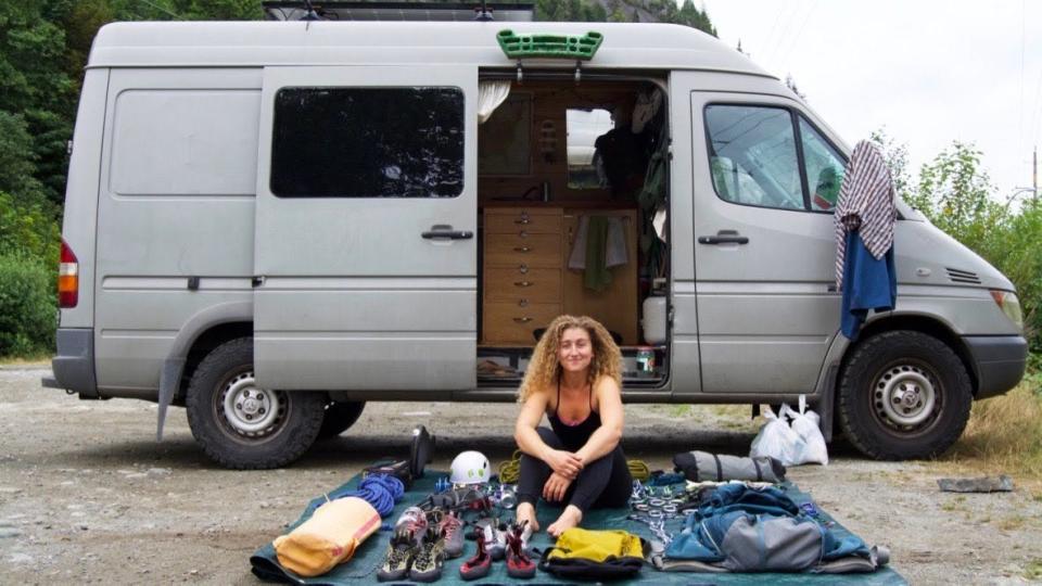 Kaya Lindsay in front of van