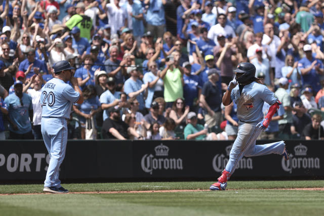 Mariners use 5-run inning to rally past Blue Jays for wild 9-8