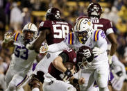 LSU defensive tackle Jaquelin Roy (99) sacks Texas A&M quarterback Zach Calzada (10) during the second quarter of an NCAA college football game in Baton Rouge, La., Saturday, Nov. 27, 2021. (AP Photo/Derick Hingle)