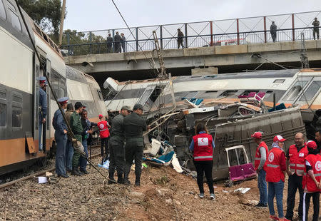 Aid workers gather at the site of train derailment at Sidi Bouknadel near the Moroccan capital Rabat, Morocco, October 16, 2018. REUTERS/Ahmed ElJechtimi