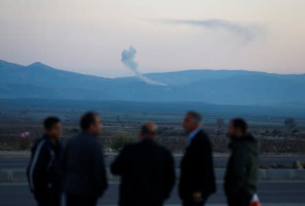 Smoke rises from the Syria's Afrin region, as it is pictured from near the Turkish town of Hassa, on the Turkish-Syrian border in Hatay province, Turkey January 20, 2018. REUTERS/Osman Orsal