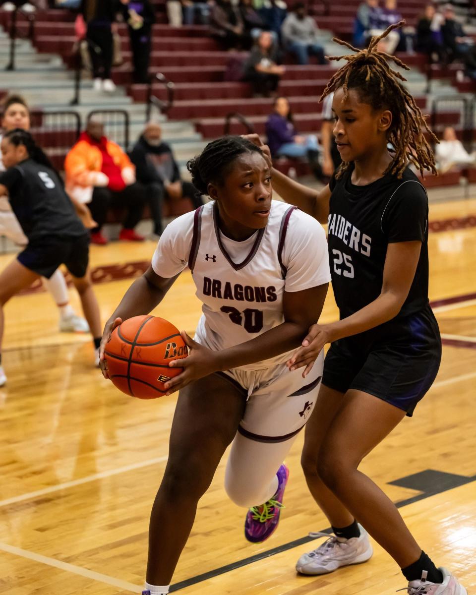 Taliyah Donaldson looks for an opening for Round Rock as Janiyah Alvarez of Cedar Ridge defends. Round Rock won a girls district basketball game 38-36 at home over Cedar Ridge on January 16th, 2024.