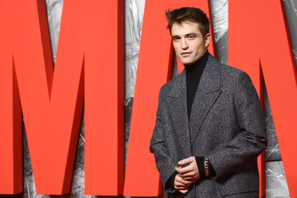 Robert Pattinson looked sharp in a grey, speckled suit. (REUTERS/Tom Nicholson)