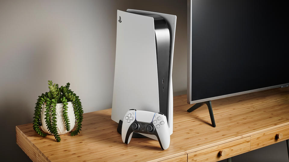 PlayStation 5 with its controller next to a TV