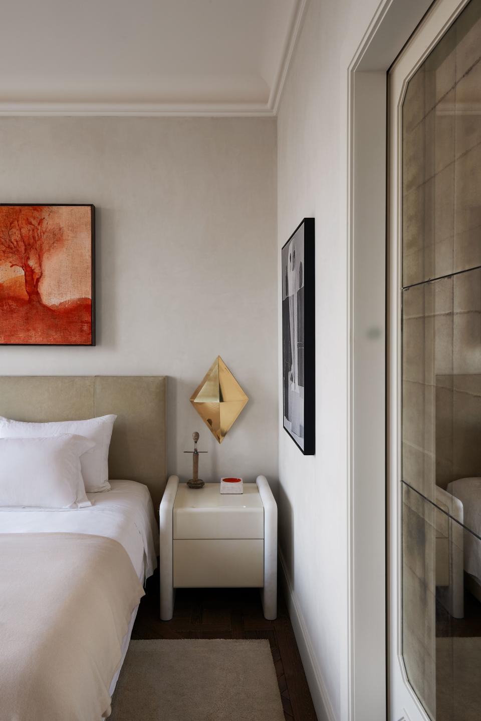 In the master bedroom, a parchment-and-marblke table flanks the bed, both by Dirand. Above bed, Leiko Ikemura painting.