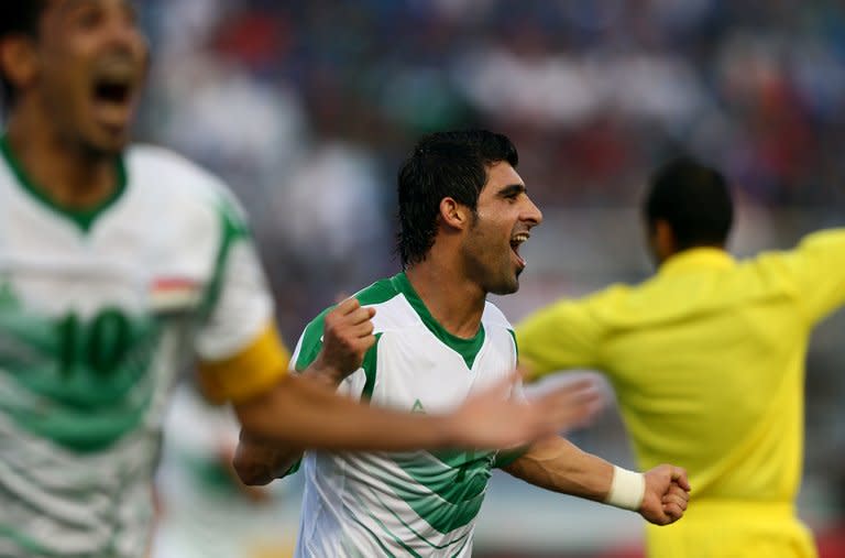 Iraq's Hammadi Ahmed Abdullah (R) and Younus Mahmood celebrate after scoring during a Gulf Cup match on January 9, 2013. Iraq will take on the United Arab Emirates in the final of the 21st Gulf Cup on Friday after both sides advanced through the group stage undefeated