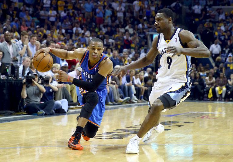 Russell Westbrook of the Oklahoma City Thunder drives past Tony Allen (R) of the Memphis Grizzlies in Game 3 of the Western Conference Quarterfinals in Tennessee on April 24, 2014